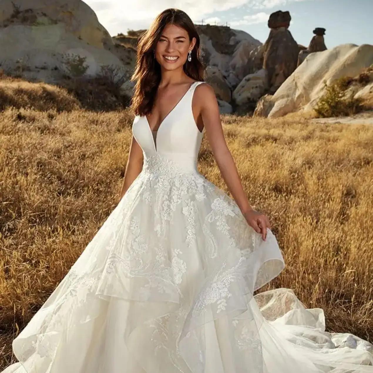 Photo of model wearing a Eddy K wedding gown